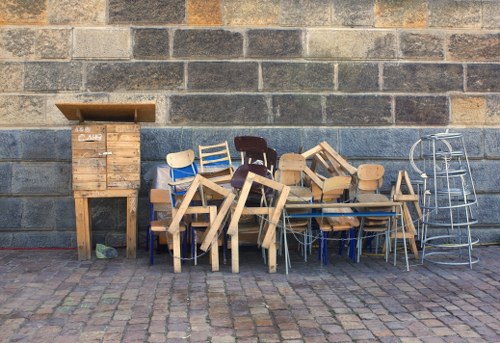 Professionals sorting items during garage clearance in North West London