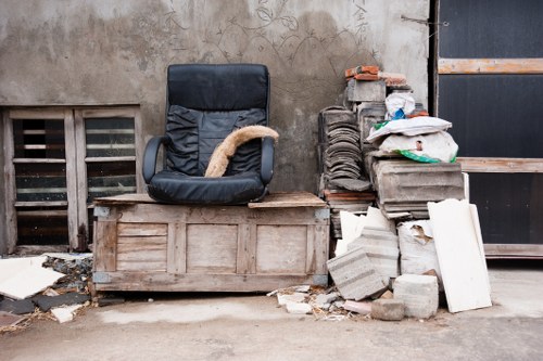 Experienced workers transporting a sofa in London